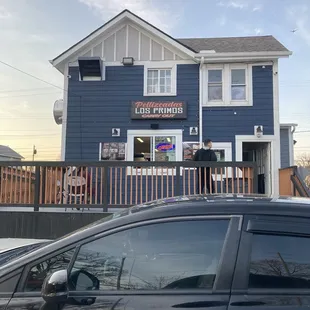 a car parked in front of a restaurant