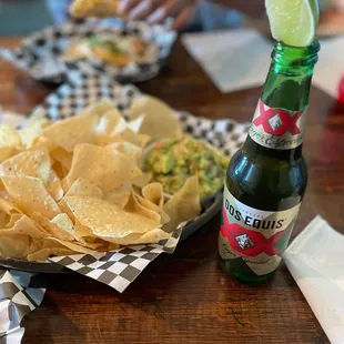 Chunky fresh made guacamole and chips with a beer!