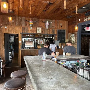 people working at a bar