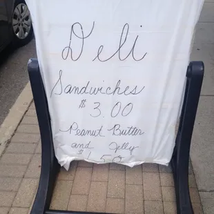 a sign on the sidewalk