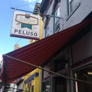 a peluso sign on the side of a building