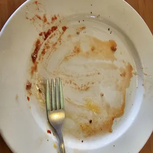 Water underneath the Personal Pizza that I Ordered!  The same thing with my Wife&apos;s Personal Pizza as well!