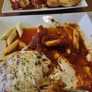 The after of my Chicken Parmigiano Dinner with a lot of Water underneath the Penne Pasta!