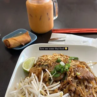 a plate of noodles, meat and vegetables