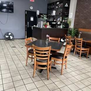 a restaurant with tables and chairs