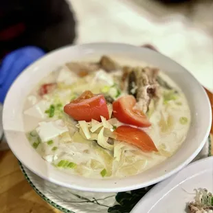 a bowl of soup and a plate of food