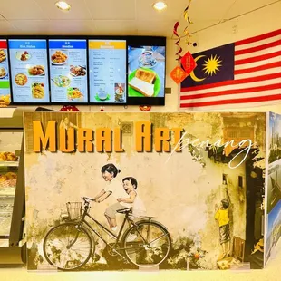 a mural of a boy on a bicycle