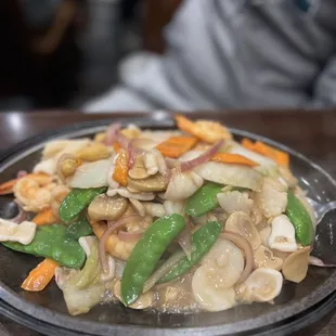 a plate of stir fried vegetables