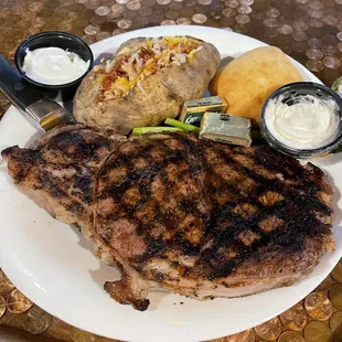 a plate of steak and potatoes