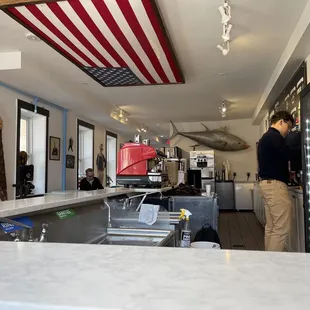  a man standing at the counter
