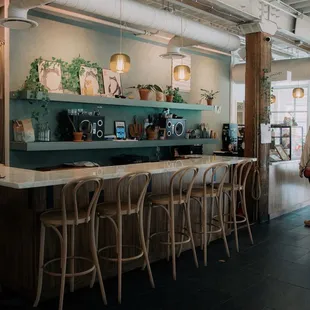 a woman standing at the bar