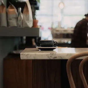 a cup of coffee on the counter