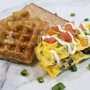 Green bell peppers, tomatoes, olives, green onions, shredded cheddar cheese, eggs