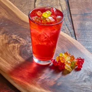 a red drink with gummy bears