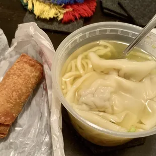 Wonton and noodle soup with egg roll.