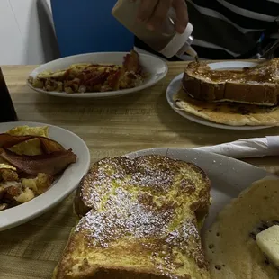 a plate of french toast and pancakes