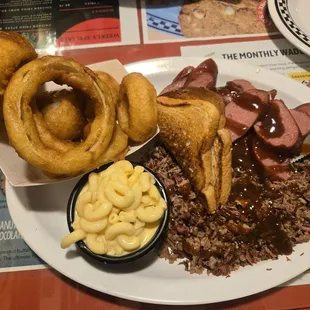 Chopped brisket,  sausage, onion rings,  Mac-N- cheese,  toast