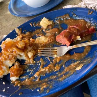 What&apos;s left of the bangers and mash. The sausages we&apos;re traditional British bangers, but was good nonetheless.