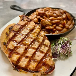 grilled pork chop and baked beans