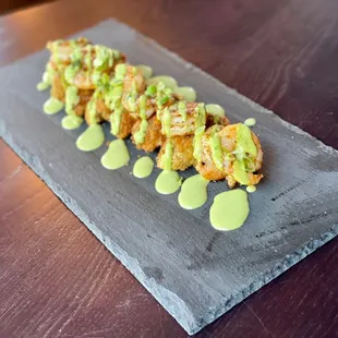 a sushi with avocado sauce