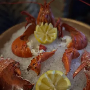 lobsters and lemon slices on ice