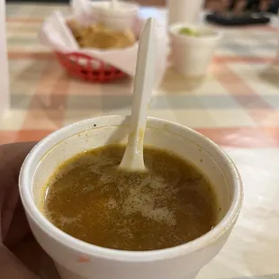 Complimentary cup of frijoles charros and in the back some chips and freshly made salsa! So good I could drink it out of the cup.