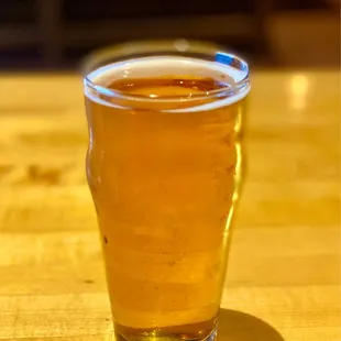 a glass of beer on a table