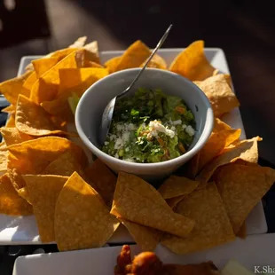 a bowl of salsa and tortilla chips