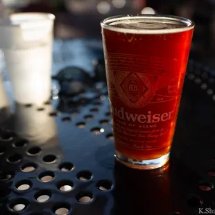 a glass of beer on a table