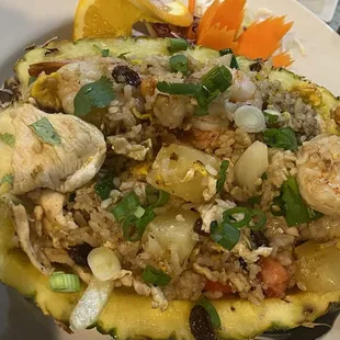 Hawaiian fried rice, served in half a pineapple.
