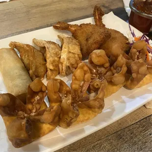 Appetizer sampler: cream cheese wontons , spring rolls, breaded shrimp and potstickers