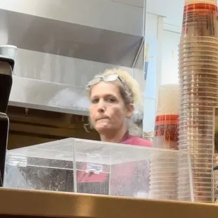 a woman behind the counter