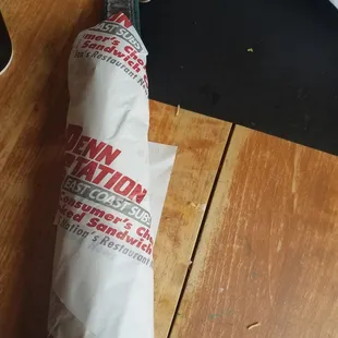 a sandwich wrapped in paper