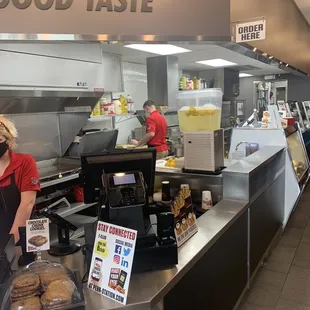 a woman standing at the counter