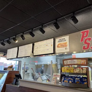 menus on the wall above the counter