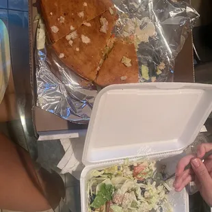 Turkey bacon and cheddar wedgie with half eaten garden salad