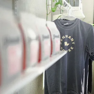 a t - shirt hanging on a shelf