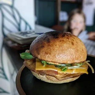 a sandwich on a black plate