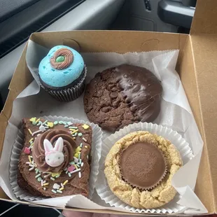 Robin egg cupcake, double chocolate chocolate chip cookie dipped in chocolate , Easter brownie, peanut butter  cookie.