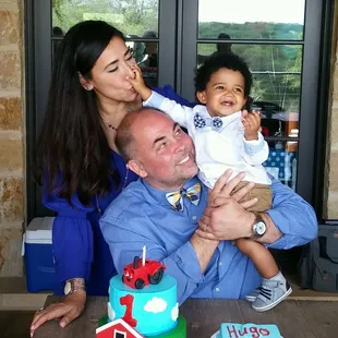 a man and a woman holding a baby