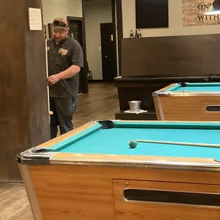 Our friend, Derek, playing pool.