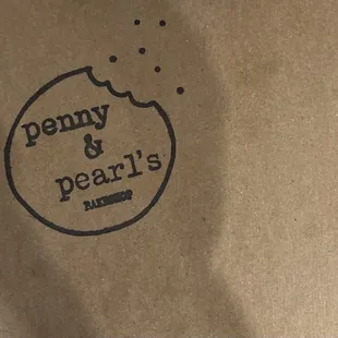 This photo is a to go box of sandwich cookies from Penny and Pearl&apos;s. It&apos;s a great place for people who love desserts!