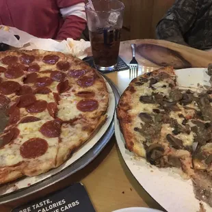 Half eaten already!! Pepperoni and onion on left. Sausage, mushroom and onion in right.