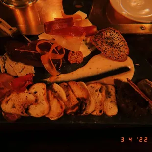 Beef pâté, charred strawberry purée, orchard compote, sweet tea boiled peanuts, imported cheeses and meats.