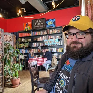 a bearded man sitting at a table