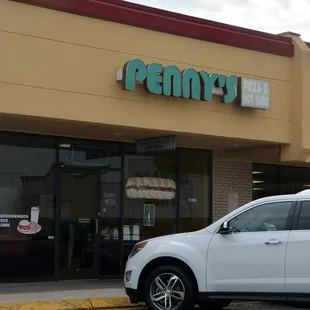a car parked in front of the store