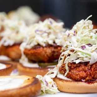 a close up of a sandwich with coleslaw