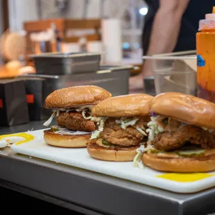 two sandwiches on a cutting board