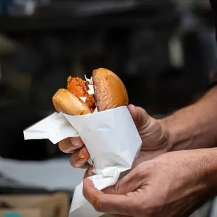 a man holding a sandwich