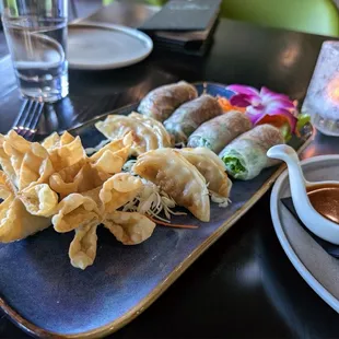 Happy hour combo, creamy rangoon, pork dumplings, spring rolls in rice paper, 1 of 4 dipping sauces.